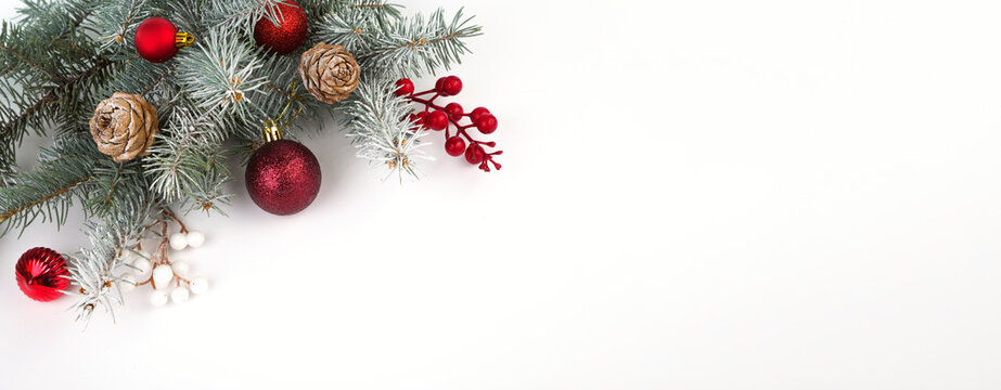 Christmas card with fir branches and Christmas decorations. Copy space