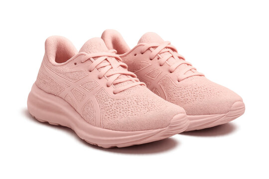 Pair of pink running shoes isolated on transparent background