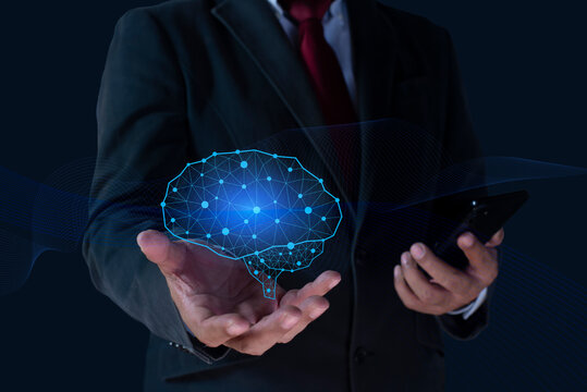 Human hand holding with floating of electric Ai digital data robot system holographic brain. The concept of intelligence, brain work, thought process.