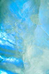Beautiful close up of quartz crystal rock shard with reflective rainbow spiritual light