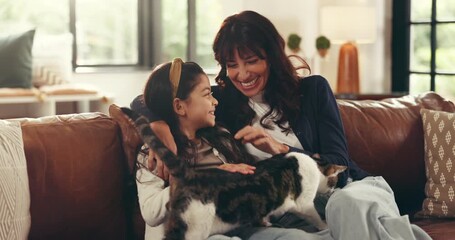 Happy, cat and face of mother with child on sofa in home for hugging, bonding or connection. Smile, love and mom embracing girl kid with kitten pet in living room on weekend together in house.
