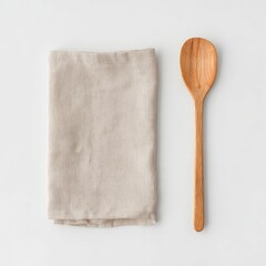 Beige linen cloth napkin and wooden spoon on white background