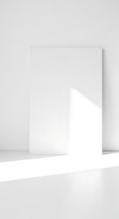 Fototapeta premium Minimalist Room Interior with Blank White Canvas and Diagonal Sunlight Shadows