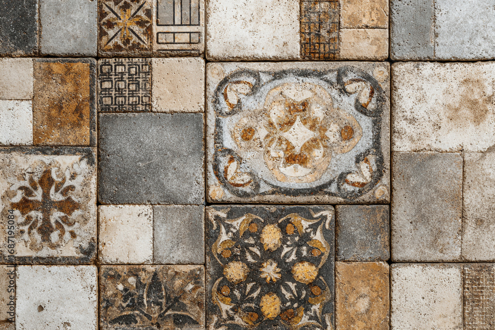 Poster a patchwork of square tiles with varying patterns and colors in earthy tones creating a rustic textu