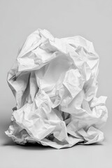 Fototapeta premium Crumpled white paper against a neutral backdrop