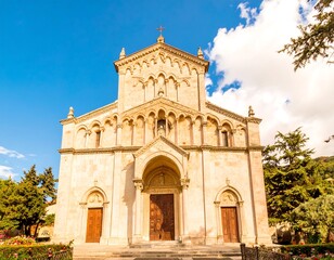 Ancient stone church facade under a bright sky