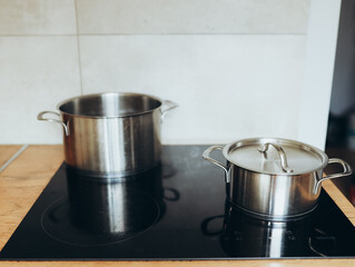 Cooking Pots Sitting on a Modern Induction Cooktop in a Kitchen