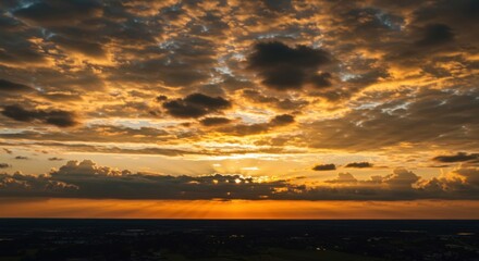 Fototapeta premium Majestic sky filled with golden evening clouds.