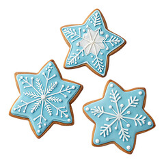 Three festive blue snowflake star shaped christmas cookies decorated with white icing isolated on transparent background