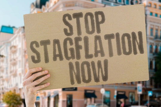 "Stop stagflation now" message on a protest banner demanding fairness and economic stability. POWER. RIGHTS. DEMOCRACY. CHANGE. VOICES. REFORM. UNITY.