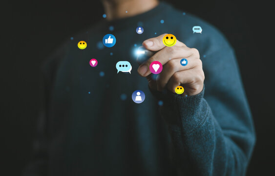 Close-up hand pointing with floating social media icons, representing digital marketing, online engagement, communication, networking, and interaction in modern business technology. - Powered by Adobe