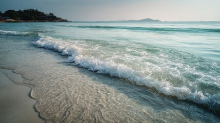 Serene Beach Landscape with Gentle Waves and Calm Water Colors