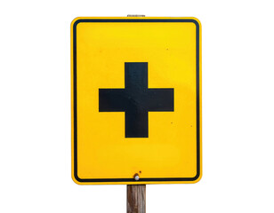 Fototapeta premium Yellow road sign with a bold black cross indicating an intersection, mounted on a wooden post.