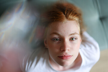 Close up portrait of a young red haired girl with green eyes, natural beauty and soft light effect.