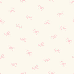 Tiny pink coquette bows on a beige background - seamless pattern design