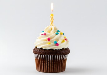 A delicious chocolate cupcake with a single lit candle and colorful sprinkles, isolated on a white background.