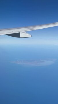 17 August 2025, Byrum, Laesoe L&aelig;s&oslash; Island, Kattegat, North Jutland Region, Denmark - distant aerial view out of airplane window