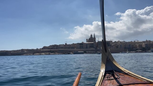 Riding the boat between Silema and Valetta overlooking cathedral
