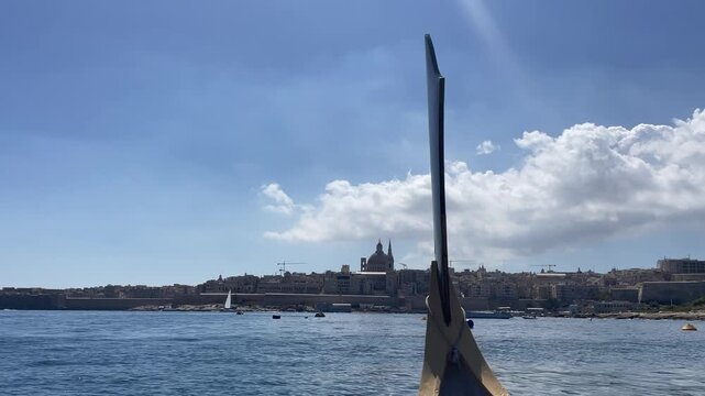 Riding the boat between Silema and Valetta overlooking cathedral