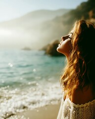 Woman Enjoying Sunlit Beach With Ocean Waves and Misty Hills