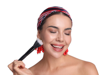 Beautiful woman applying makeup with brush on white background