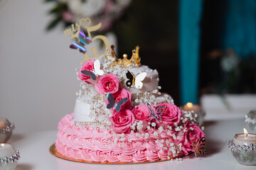 quinceanera cake and decoration with flowers