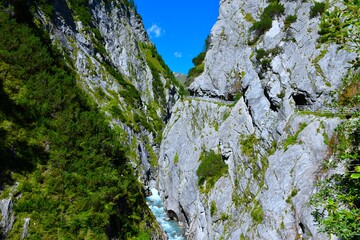 View of Daberklamm gorge with a hiking trail and a river flowing at Dorfertal near Kals in Tyrol, Austria