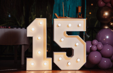 number 15 with light bulbs on