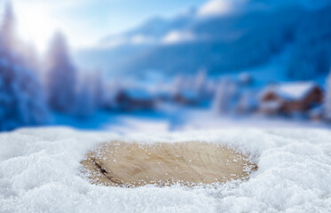Empty copy space on fresh snow with background of frozen winter mountains and clear blue sky on sunny day. Concept of winter holidays, seasonal product placement, cold weather and mountain nature.