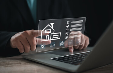 Hand touching digital checklist with smart home icon on virtual screen. Concept of property management, smart technology, and home automation for security, efficiency, and modern living.