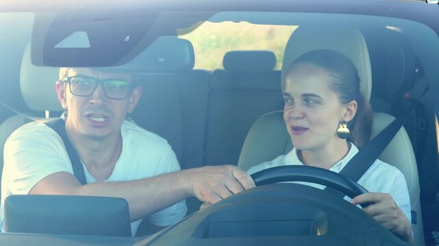 Driving lesson in a sunny location with a student and instructor sharing tips and guidance for improved skills