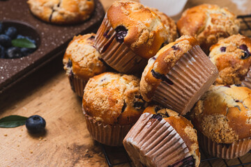 Blueberry muffins on a rustic table in a mold