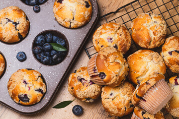 Blueberry muffins on a rustic table in a mold