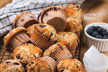 Blueberry muffins on a rustic table in a mold