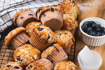 Blueberry muffins on a rustic table in a mold