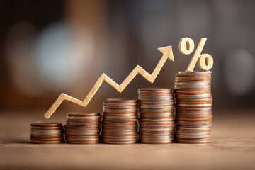 Rising interest rates shown with coins and upward arrow