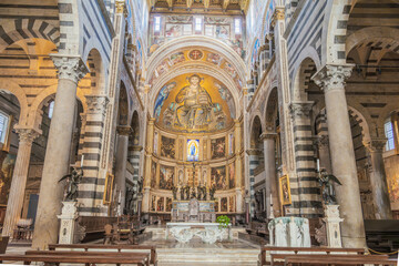 Cathedral interior showcases grand mosaic, striped pillars, and religious art for a stunning...