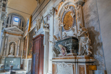 Elaborate sculptural monument in an Italian church. Baroque architecture and carvings of angels and...