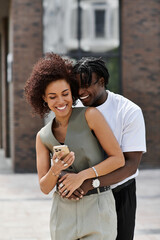 Young couple enjoys a sunny date in the heart of a vibrant city