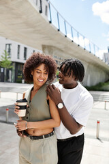Stylish young couple enjoys a summer date in the lively city streets