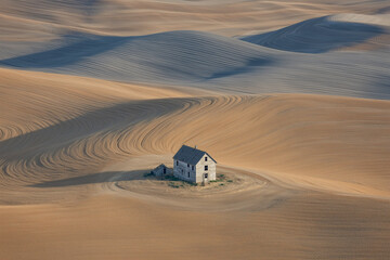aerial shot of farmhouse after harvest season