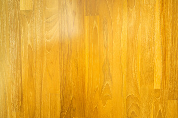 Light-colored teak wood texture close-up with natural grain and patterns.