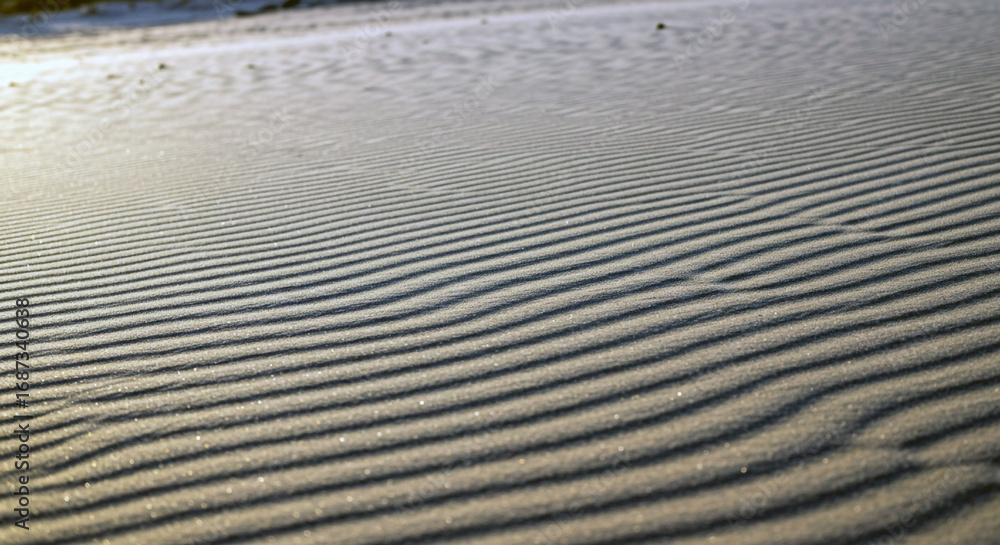 Poster close up abstract view of undulating sand dunes with textured patterns and soft natural light creati