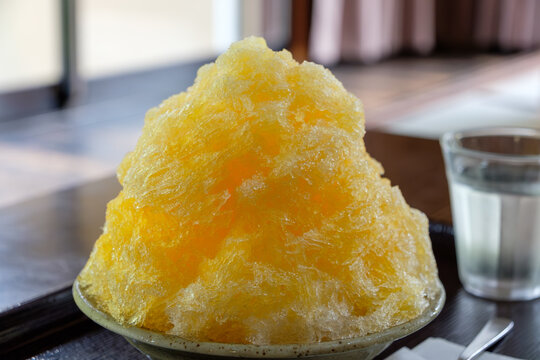 Refreshing yellow shaved ice dessert in summer