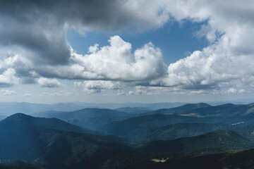 clouds over the ukrainian carpathian mountains view from hoverla peak highest in the country with green beautiful valleys in summer 