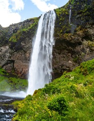 Majestic waterfall cascading down rocky cliff