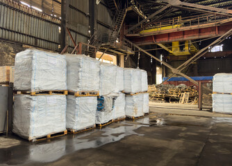 warehouse with big bags on pallets