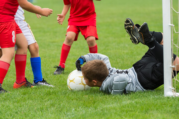 Kids play football child soccer field