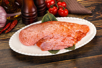 Raw marinated duck breast for cooking