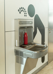 Water refill point for your bottle at the airport.